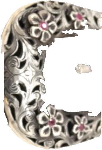 A deeply engraved sterling ranger buckle with filigree scrollwork and small set rubies.