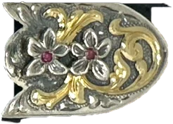 The tip: a pointed sterling cap with gold scrollwork that finishes the end of the strap.