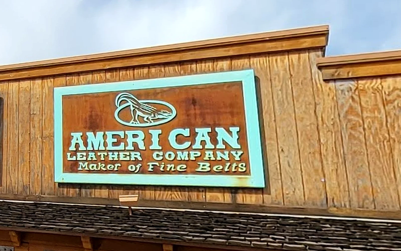 The carved American Leather Company, Maker of Fine Belts sign over the shop in Old Town Scottsdale.