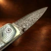 Liner Lock Damascus Folding Pocket Knife w/ Turquoise, MOP, & Wood Handle — detail view 2